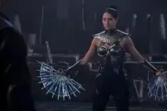 Kitana (Adeline Rudolph) displays her fan weapons in Mortal Kombat 2