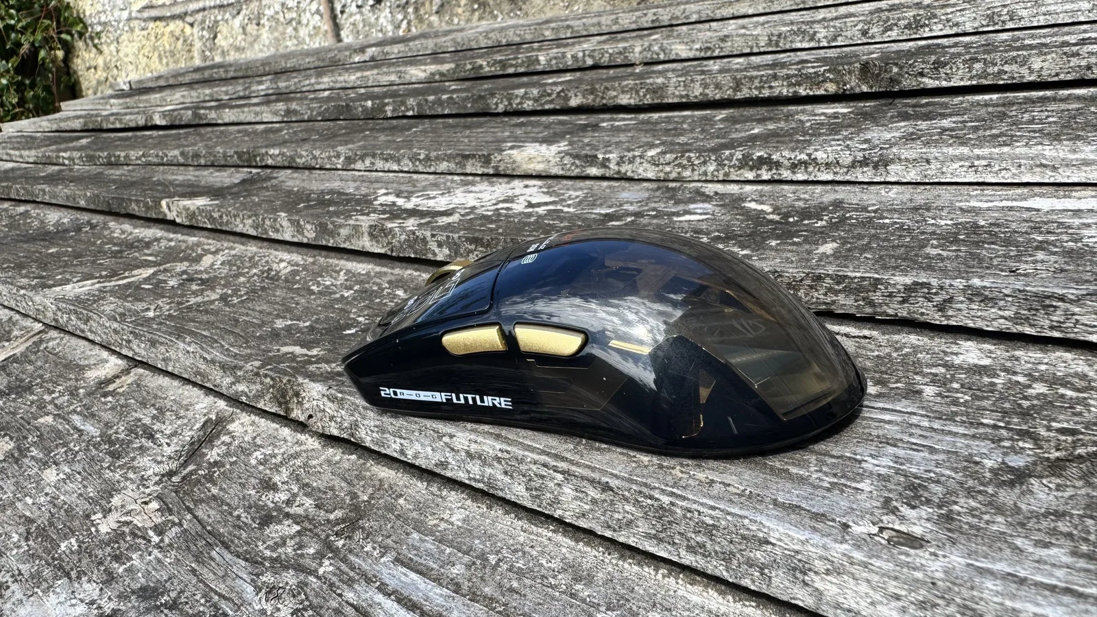 Asus ROG Harpe II Extreme Edition 20, on top of wood, from the back left
