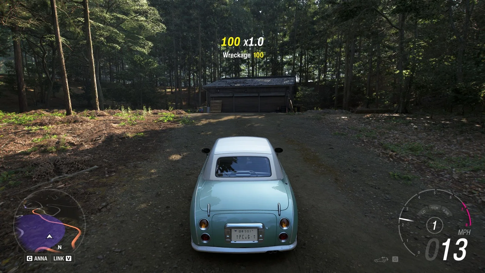 Forza Horizon 6 Barn Finds: A player parked outside an old wooden barn on a wooded hillside.