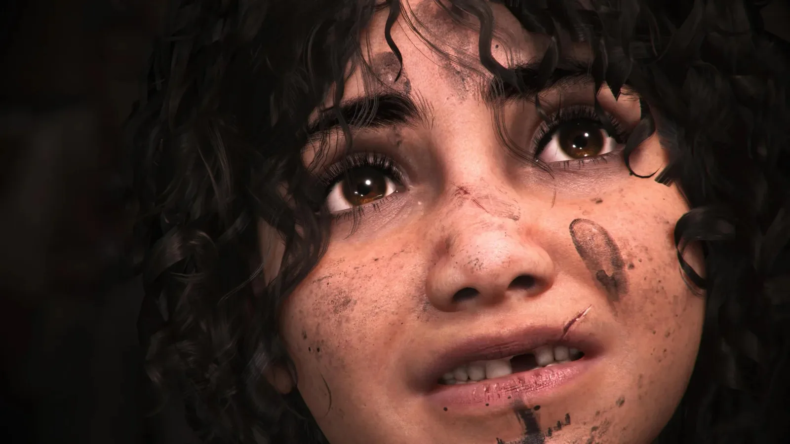Resonance: A Plague Tale Legacy screenshot showing a wide-eyed, gap-toothed young girl with a muddy face looking a bit sad