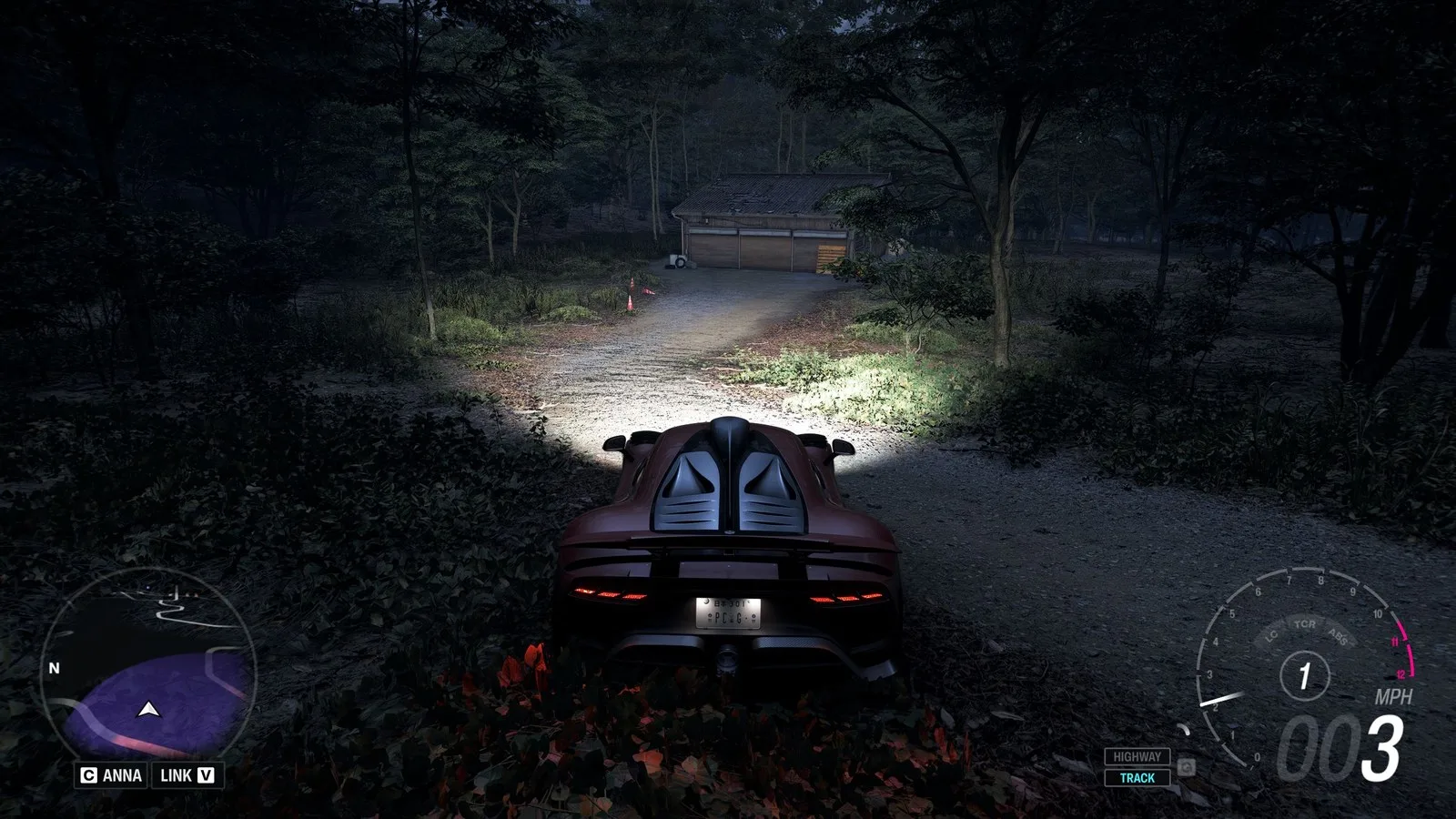 Forza Horizon 6 Barn Finds: A player parked outside an old wooden barn on a wooded hillside at night.