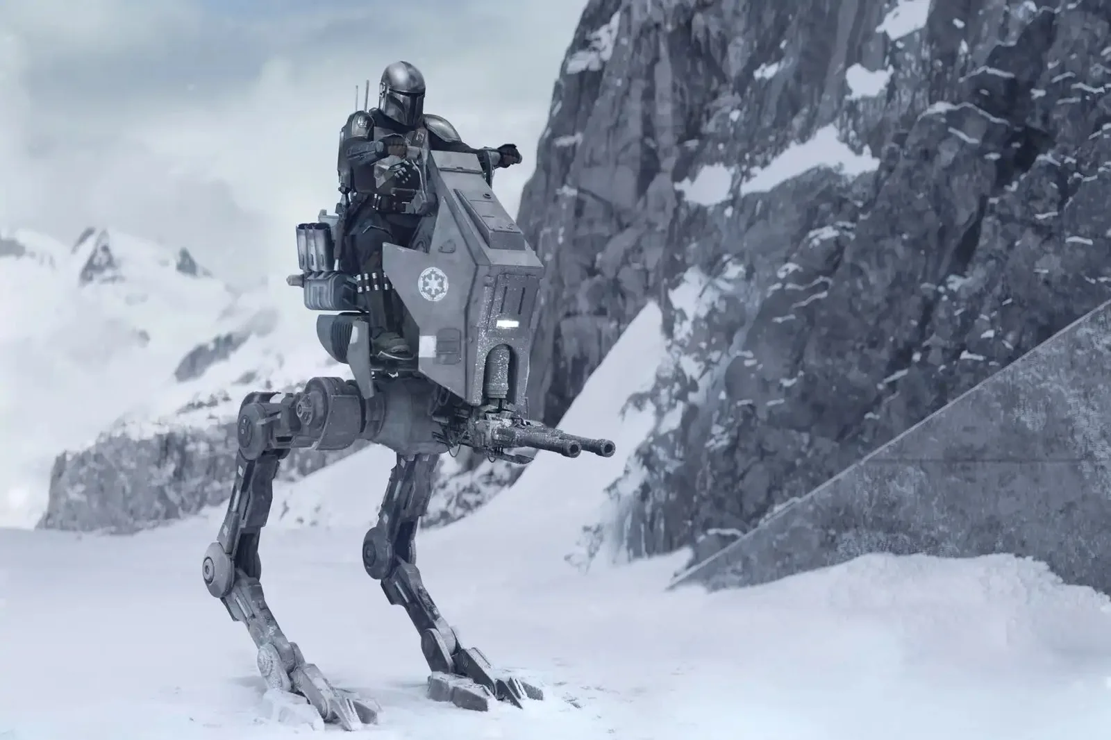 Din Djarin steers a walker on a snowy planet in The Mandalorian and Grogu