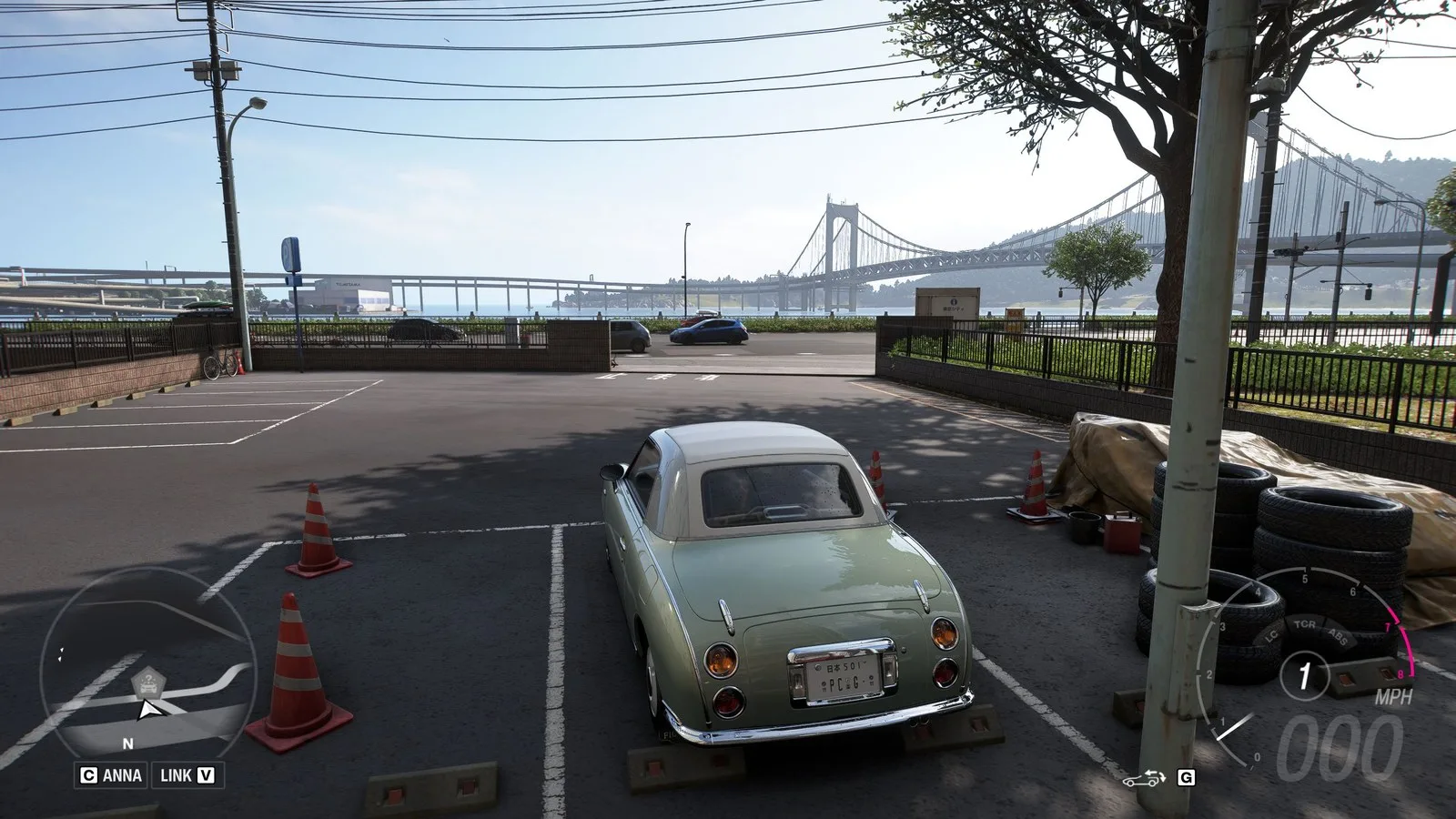 Forza Horizon 6 Treasure Cars: A Nissan Figaro parked on the coast, opposite a large bridge.