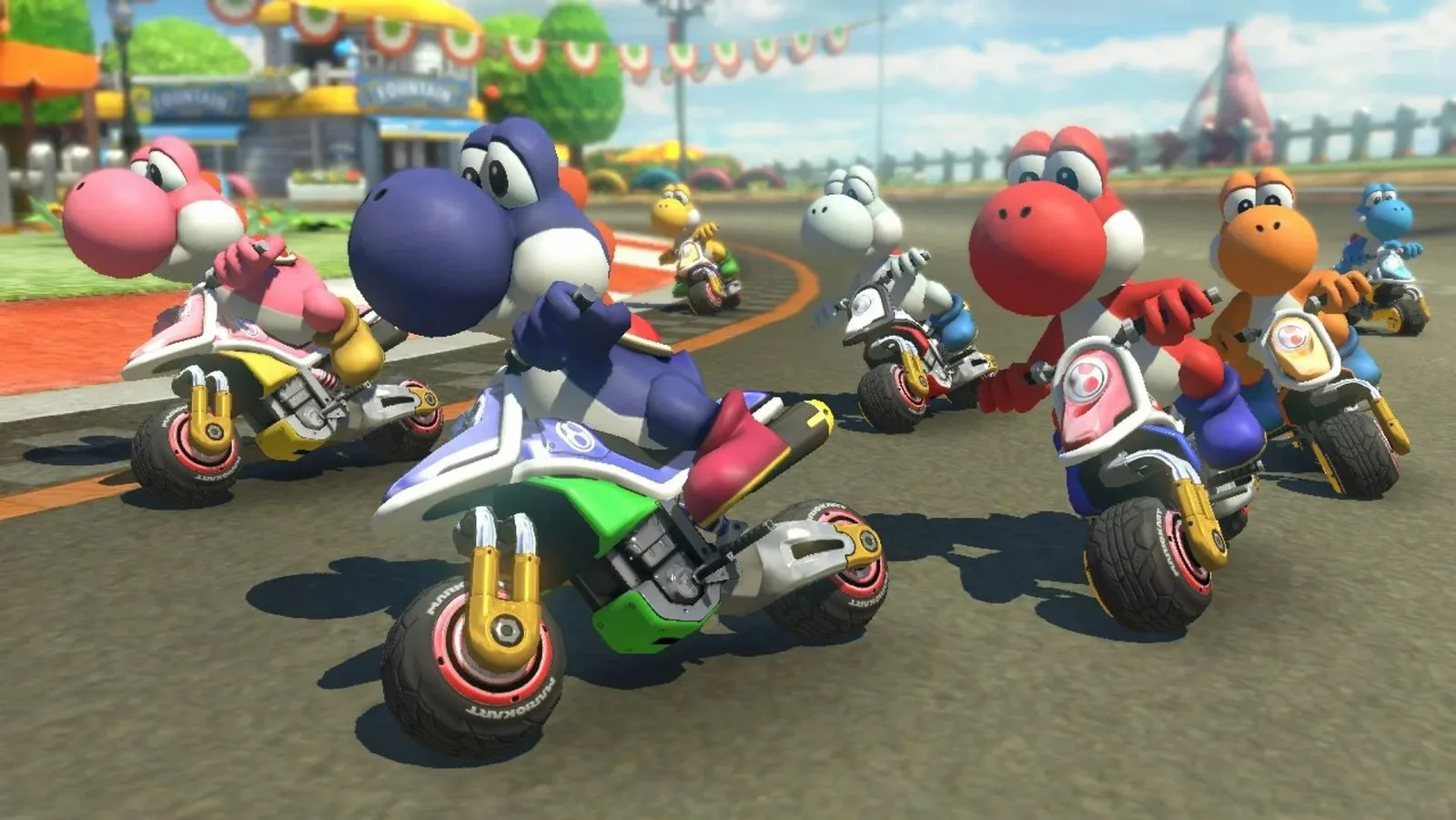 Screenshot from Mario Kart 8 Deluxe, showing seven differently coloured Yoshis racing side by side on motorbikes.