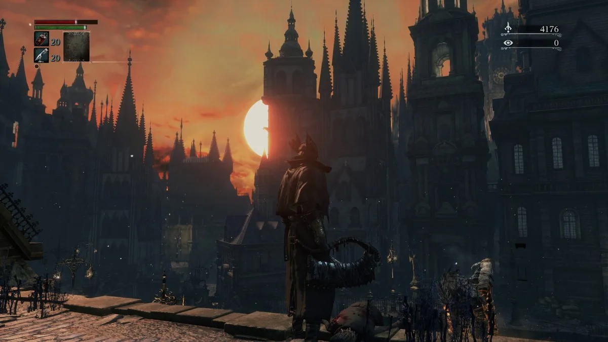 Hunter looking out over Yharnam cityscape in Bloodborne.