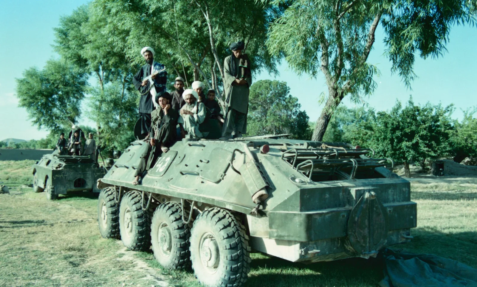 Muj sitting on the captured armour personnel carriers. — 1990 Dönemi Askeri Tarih Belgesi