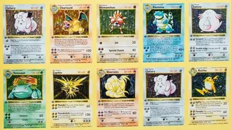 An uncut sheet of cards. Each card has a different element, art, and stats.